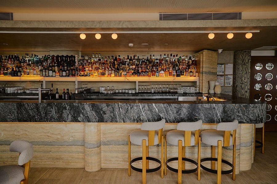 Seating at the central bar at Fleet Rooftop Bar