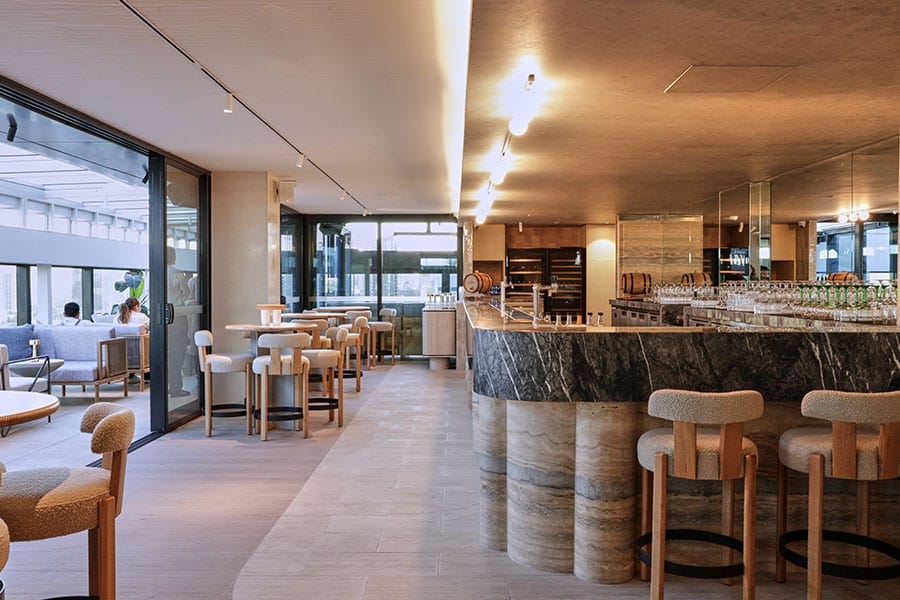 Indoor high-top seating at Fleet Rooftop Bar